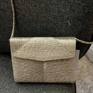 Silver and gold, made in Italy for Neiman’s small shoulder purse. Spotless.